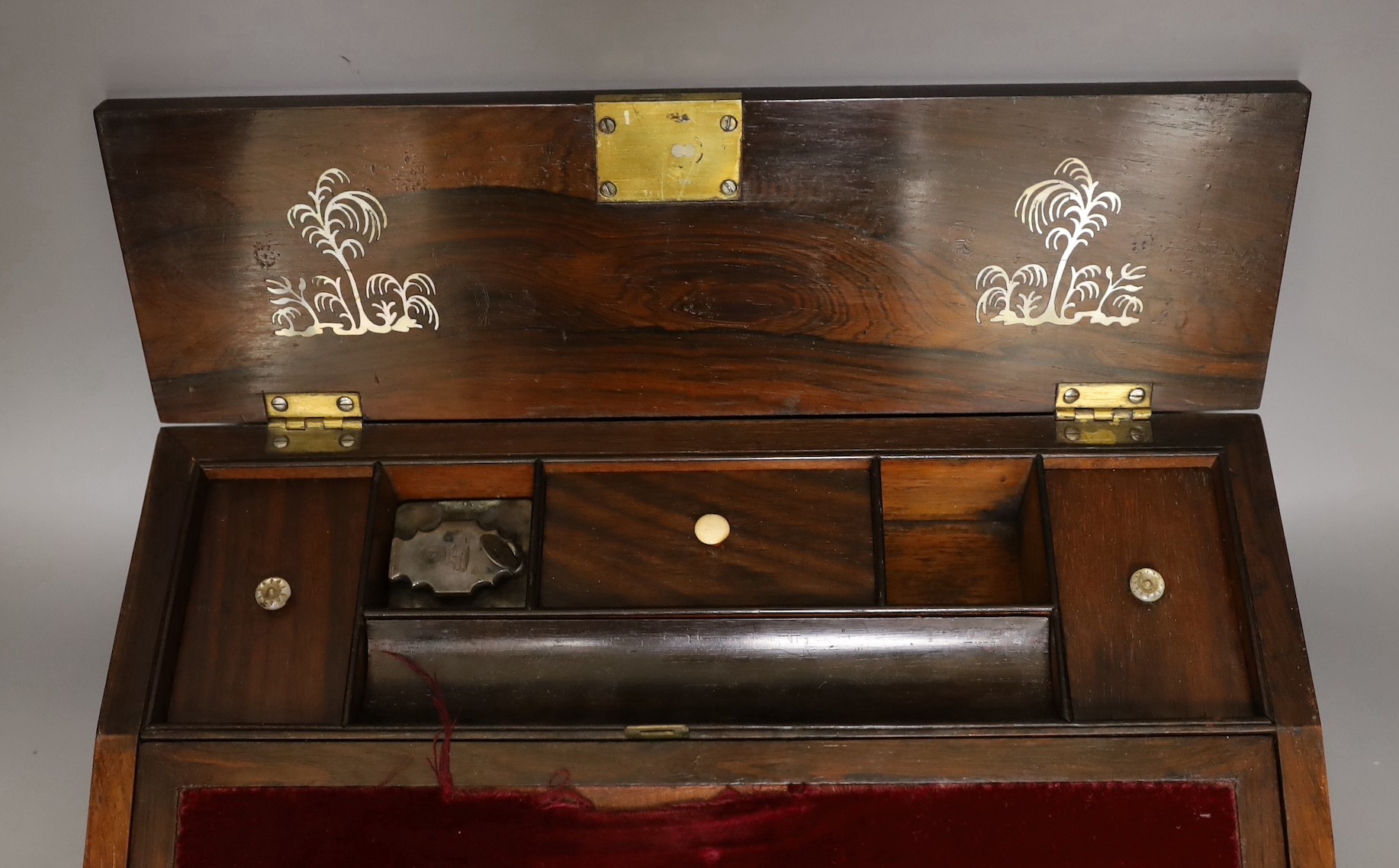 A 19th century rosewood veneered, mother of pearl inlaid writing slope, 35cms wide x 26cms deep